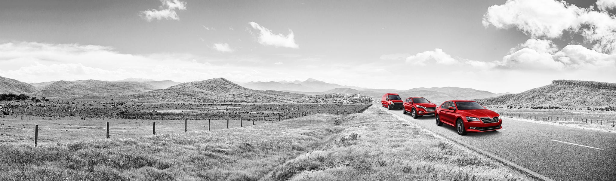 Matador 2018 Visual 3-Cars - Red Cars on road with Village and Hills in Backround