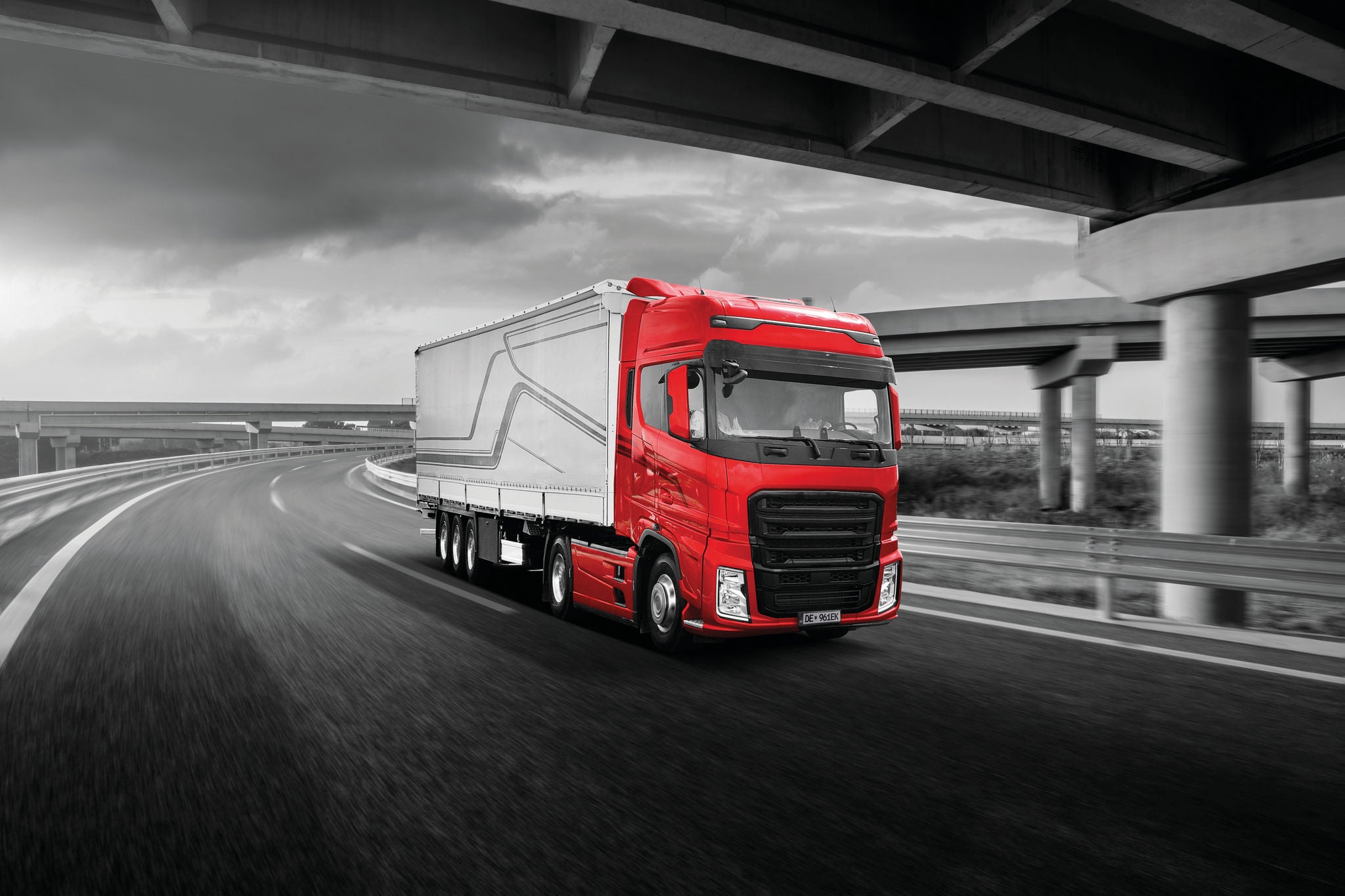 Empty asphalt highway and bridge building scenery at sunset